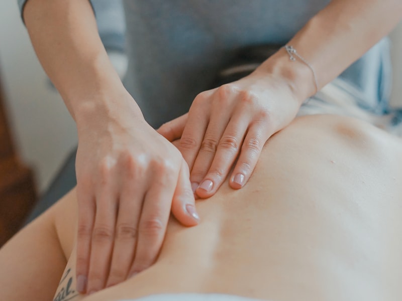 Chiropractor performing a gentle spinal adjustment